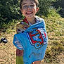 barefoot, casual_clothing, child, daylight, dirt, grass, greenery, happy, nature, outdoor, paw_patrol, playful, portrait, sandals, smiling, summer, sunlight, towel, wet_hair, young