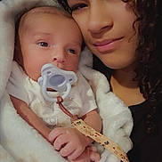 Kody joined the competition — help win amazing prizes! baby, blanket, child, closeup, comfort, cuddle, curly_hair, face, family, holding, indoor, love, newborn, pacifier, person, portrait, soft, together, warm, woman
