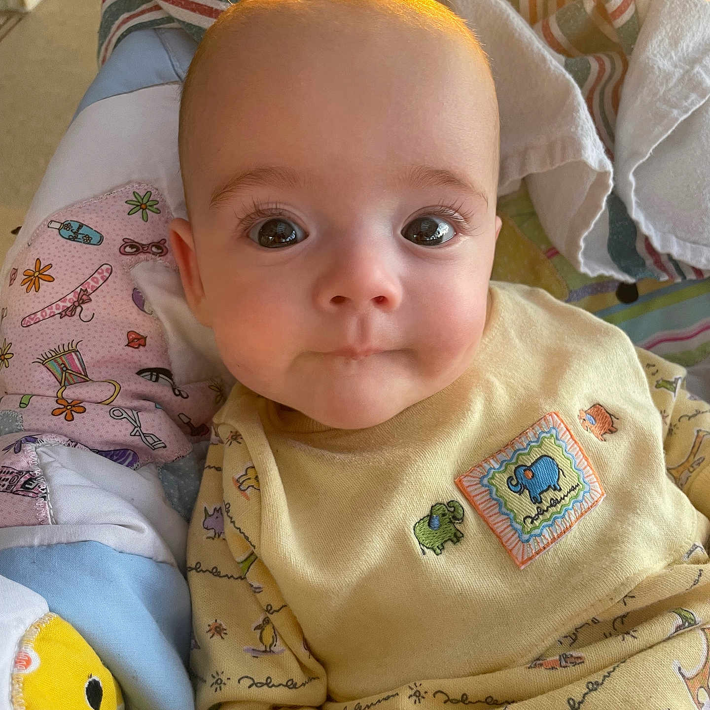 Naomi joined the competition — help win amazing prizes! applique, baby, bed, blanket, bodypart, cushion, face, finger, furniture, hand, happy, head, homedecor, newborn, pattern, person, photography, portrait, quilt, smile