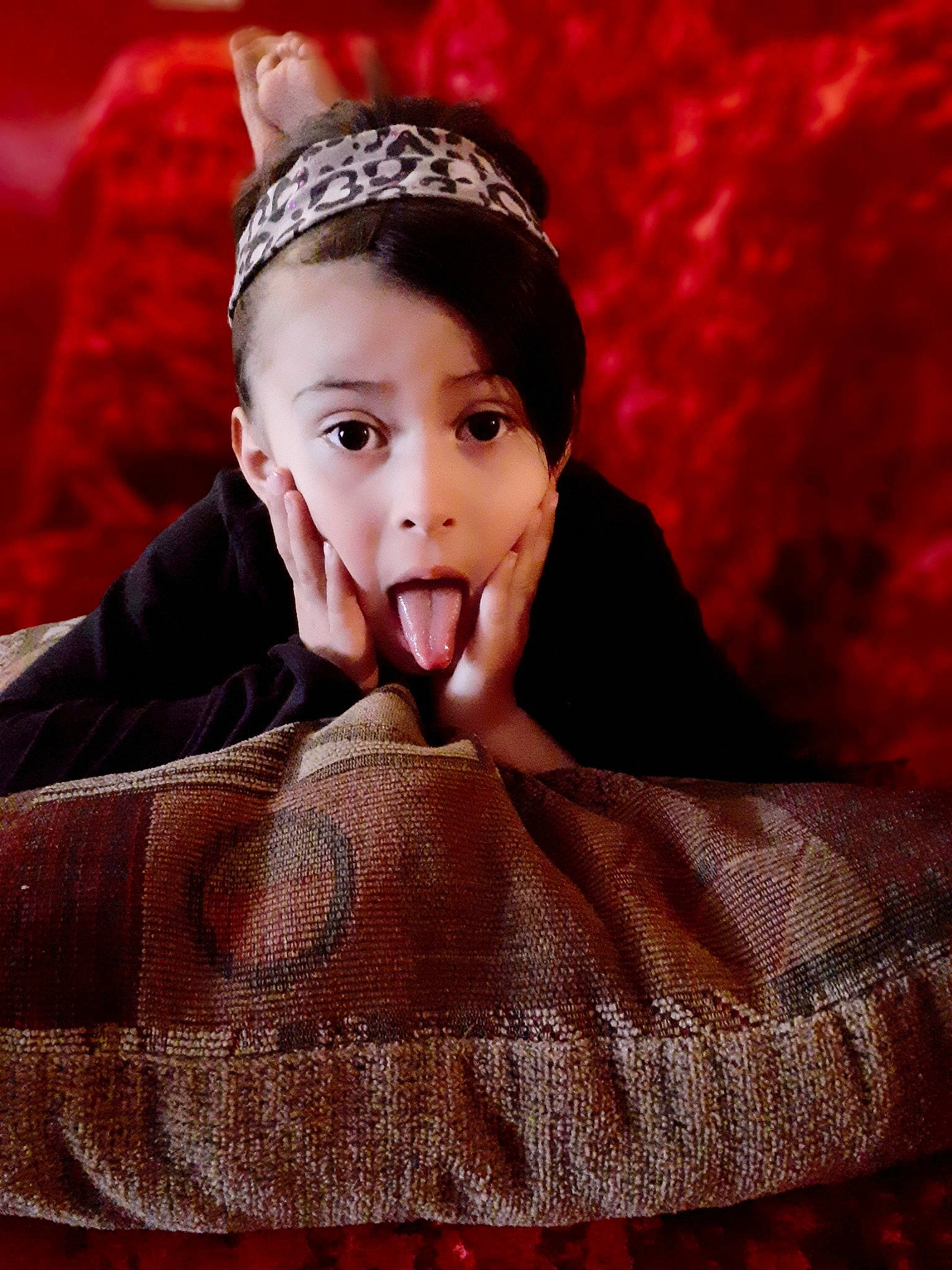 Nevaeh is registered to the contest to win money with this photo: beauty, child, ear, fur, furniture, headgear, headpiece, lip, person, photography, portrait, red, surprise