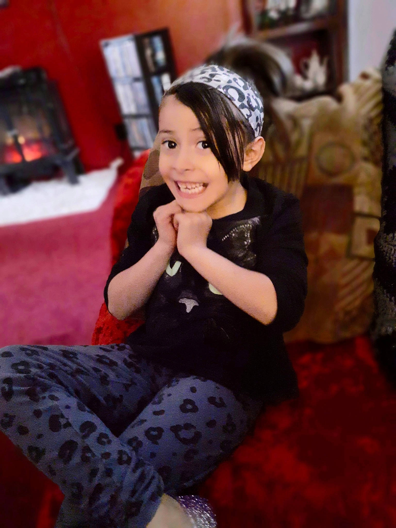 Nevaeh is registered to the contest to win money with this photo: beauty, black_hair, design, fashion_accessory, hair_accessory, headband, headgear, headpiece, joy, long_hair, pattern, person, photography, sitting, smile