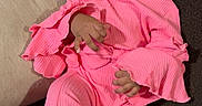Delilah is registered to the contest to win money with this photo: baby, child, smiling, pink_outfit, bow, shoe, hand, couch, indoor, portrait, cute, happy, toddler, fashion, home, sitting, furniture, person, face, cozy