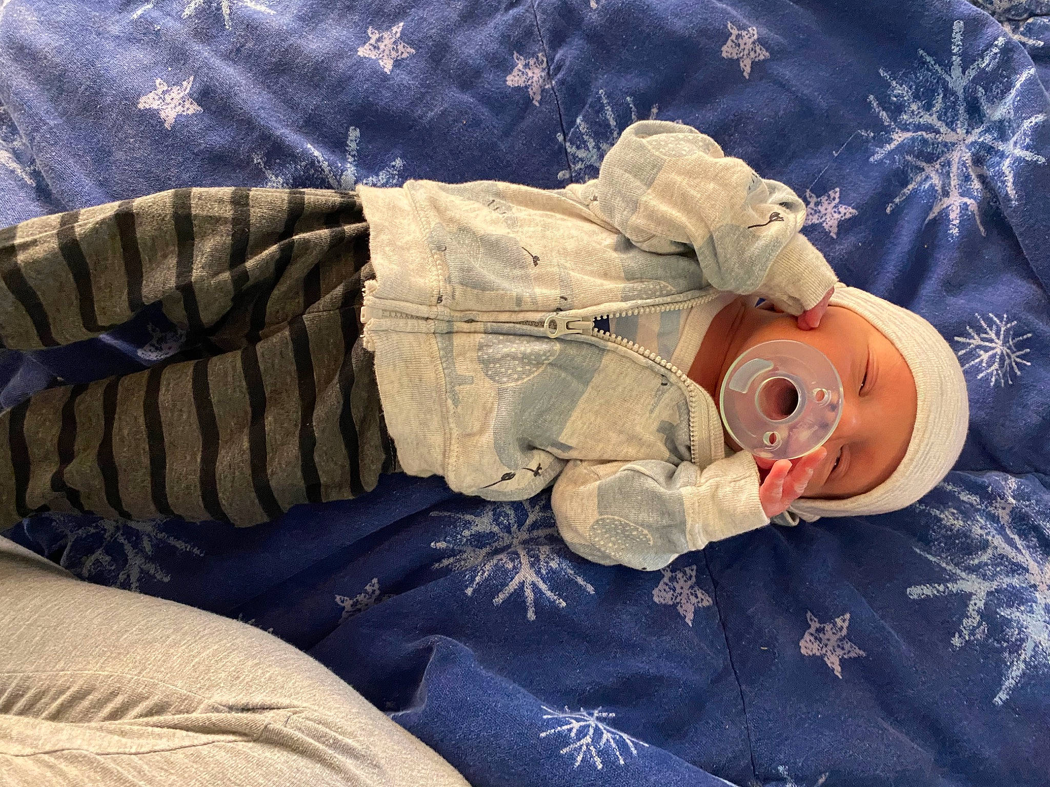 Brayson is registered to the contest to win money with this photo: art, baby, child, comfort, couch, denim, hat, human_body, human_leg, linens, pattern, person, sitting, sleep, textile, toddler, visual_arts, winter