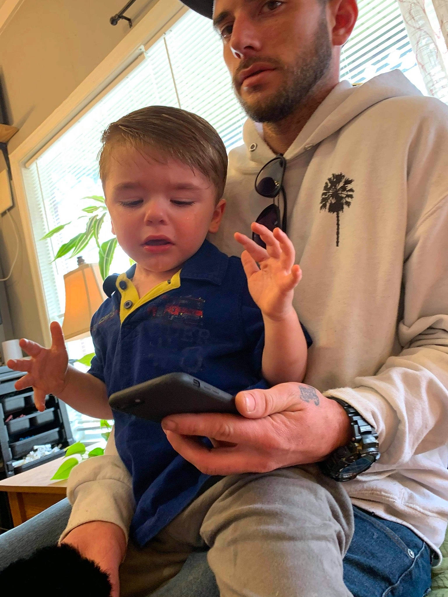 Cooper joined the competition — help win amazing prizes! arm, beard, cap, child, clothing, event, finger, fun, gesture, hand, happy, headwear, joint, lap, muscle, person, shoulder, sitting, skin, t_shirt