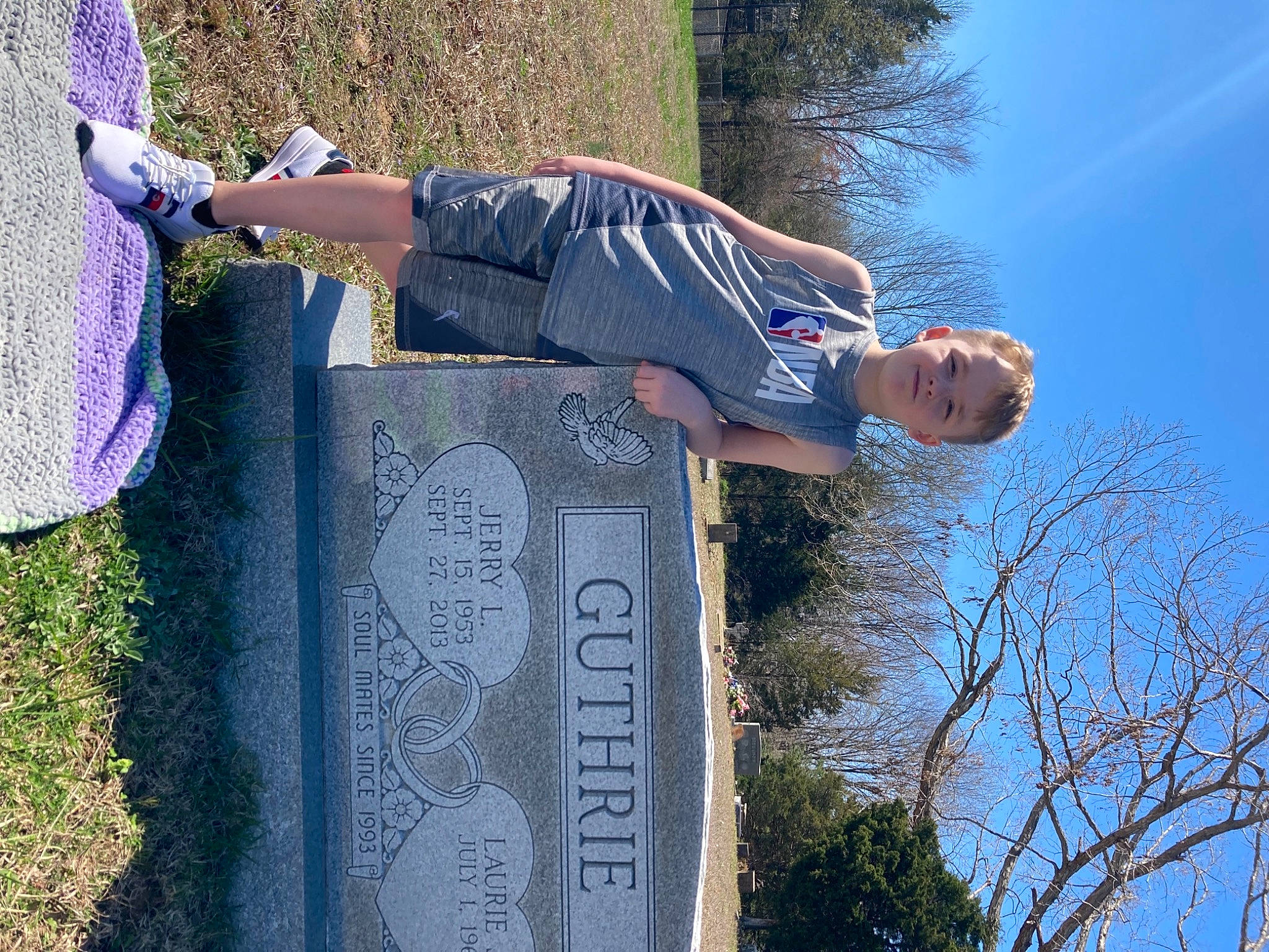 Braiden is registered to the contest to win money with this photo: art, blue, cemetery, daytime, electric_blue, fun, grass, grave, green, happy, leisure, light, line, people_in_nature, person, plant, sky, spring, t_shirt, tree
