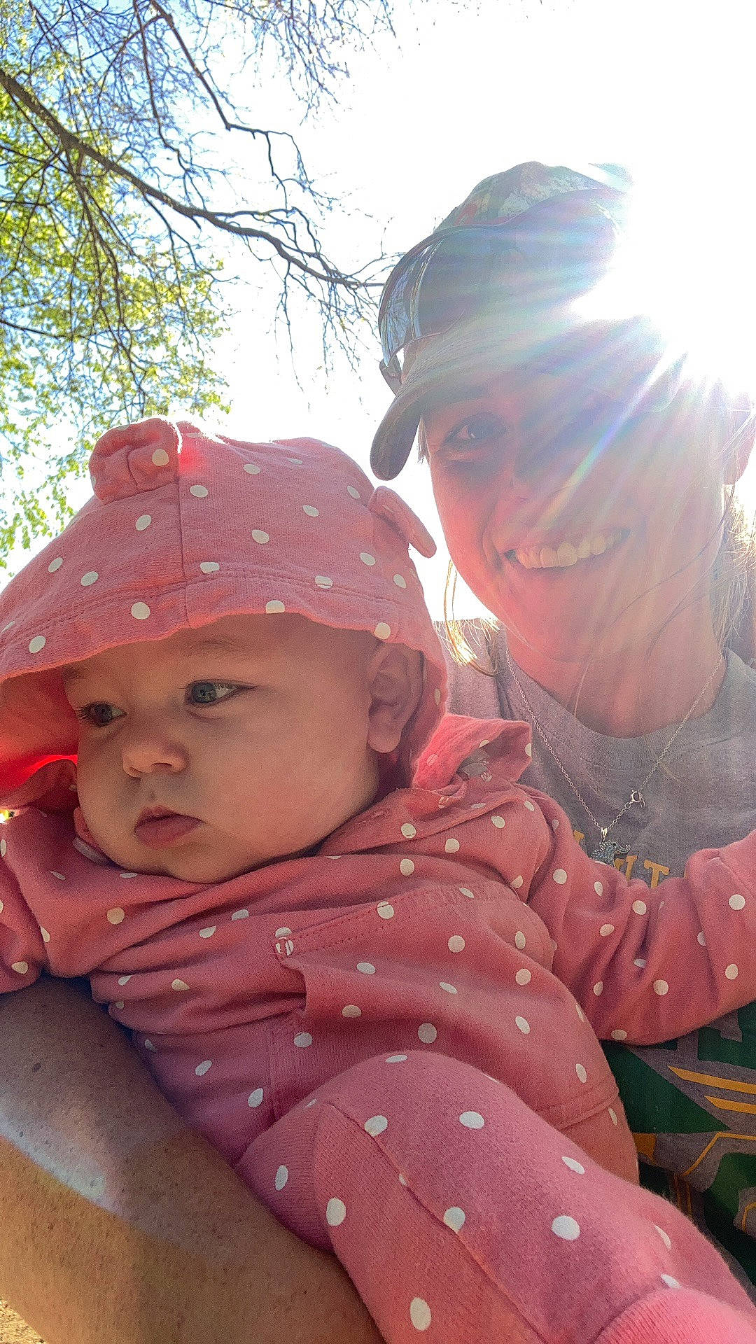 Jerri-lynn is registered to the contest to win money with this photo: baby, baseball_cap, cap, child, fashion_accessory, fun, grass, happy, headgear, headwear, leisure, magenta, people_in_nature, person, pink, recreation, sky, smile, sun_hat, toddler