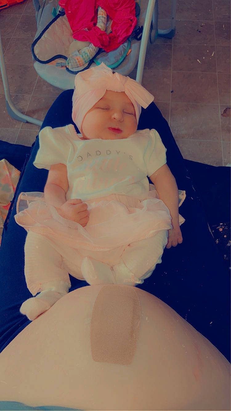 Annalee joined the competition — help win amazing prizes! baby, baby_products, baby_toddler_clothing, child, comfort, dress, fashion_accessory, foot, fun, happy, hat, headwear, human_body, human_leg, peach, person, room, sitting, sleeve, thigh