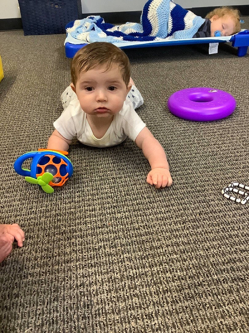 Braxton joined the competition — help win amazing prizes! baby, baby_toddler_clothing, blue, carpet, child, comfort, crawling, floor, flooring, fun, grass, happy, hardwood, joint, leg, leisure, person, textile, toddler, toy