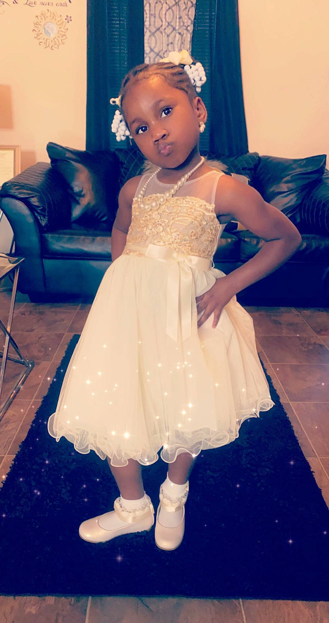 Roquavia is registered to the contest to win money with this photo: baby_toddler_clothing, blue, bridal_party_dress, couch, day_dress, dress, face, flash_photography, floor, flooring, happy, head, headgear, iris, one_piece_garment, person, shoulder, standing, textile, toddler