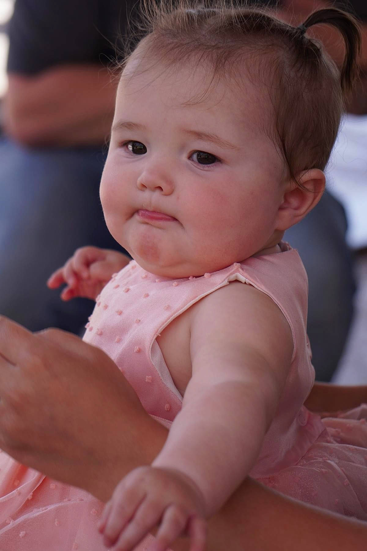 Mira joined the competition — help win amazing prizes! baby, baby_toddler_clothing, cheek, child, comfort, dress, eyelash, facial_expression, fun, gesture, happy, iris, lip, nail, nose, person, sitting, skin, sleeve, thumb