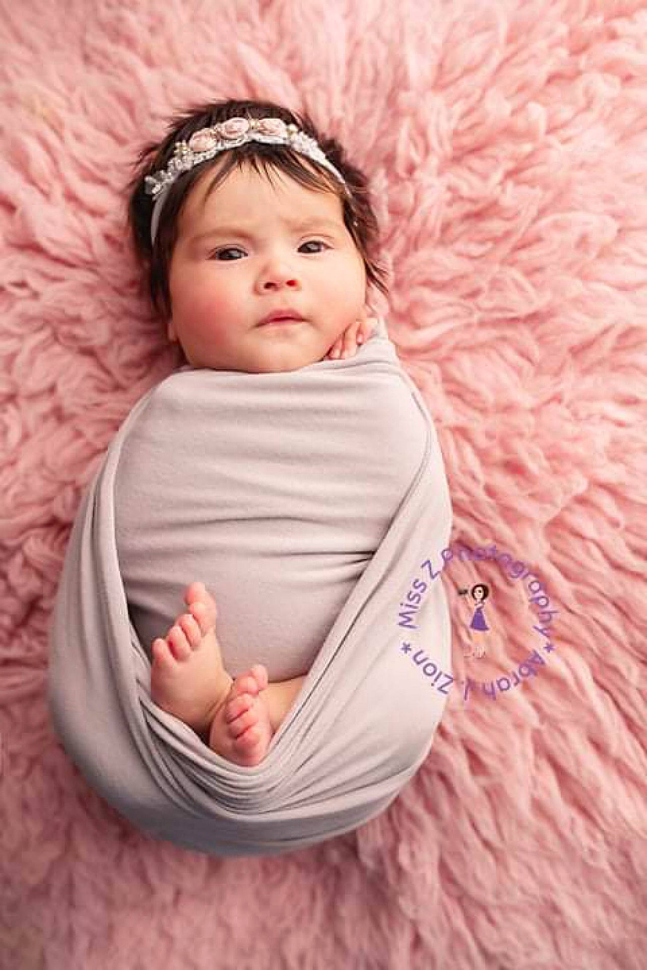Aliana is registered to the contest to win money with this photo: arm, baby, baby_sleeping, baby_toddler_clothing, child, comfort, face, finger, foot, fun, happy, headband, headwear, linens, lip, person, pink, skin, sleeve, textile