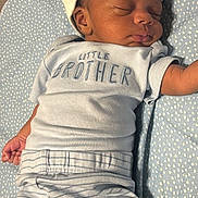 Josiah Lewis joined the competition — help win amazing prizes! baby, sleeping, infant, hat, clothing, striped_pants, blanket, blue, cute, peaceful, face, newborn, child, person, soft, resting, little_brother, toddler, indoors, cozy