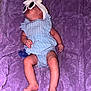 baby, infant, sunglasses, headwrap, blue_outfit, striped_clothing, purple_blanket, pacifier, lying_down, barefoot, cute, sleeping, soft_texture, indoors, child, person, fashion, accessories, newborn, cozy