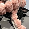 Grimm joined the competition — help win amazing prizes! animal, black_dog, chewing, closeup, cute, dog, ear, fabric, fur, gray_background, indoor, lying_down, pet, pink_pom_poms, playful, plush_toy, snout, soft_texture, teeth, toy