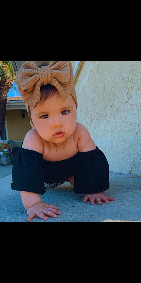 Bonnie joined the competition — help win amazing prizes! baby, baby_toddler_clothing, child, fashion_accessory, fawn, finger, flash_photography, floor, flooring, foot, fun, happy, headband, human_leg, knee, person, sitting, skin, t_shirt, toddler