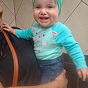 Willow joined the competition — help win amazing prizes! toddler, child, smiling, person, adult, holding, headband, bow, turquoise, sweater, cat_face, jeans, hand, arm, indoor, tile_wall, happy, cute, clothing, portrait