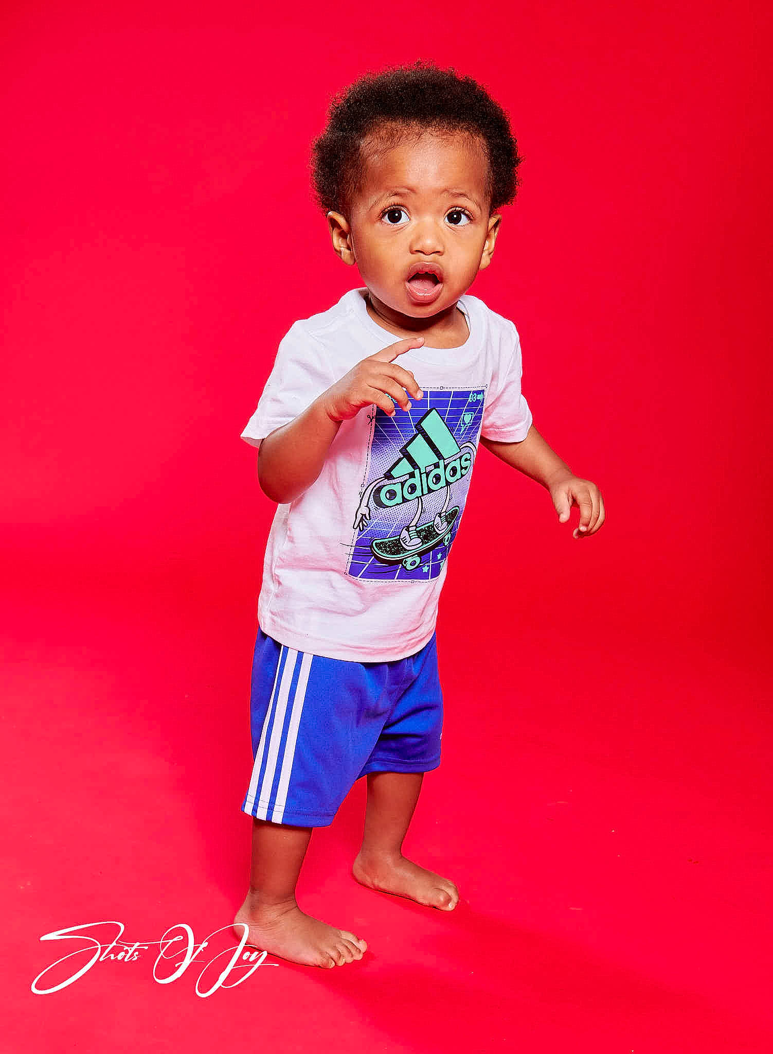 Ermias is registered to the contest to win money with this photo: baby, baby_toddler_clothing, barefoot, child, electric_blue, fashion_design, flooring, fun, gesture, happy, human_body, magenta, pattern, person, play, shorts, sleeve, surprise, t_shirt, toddler