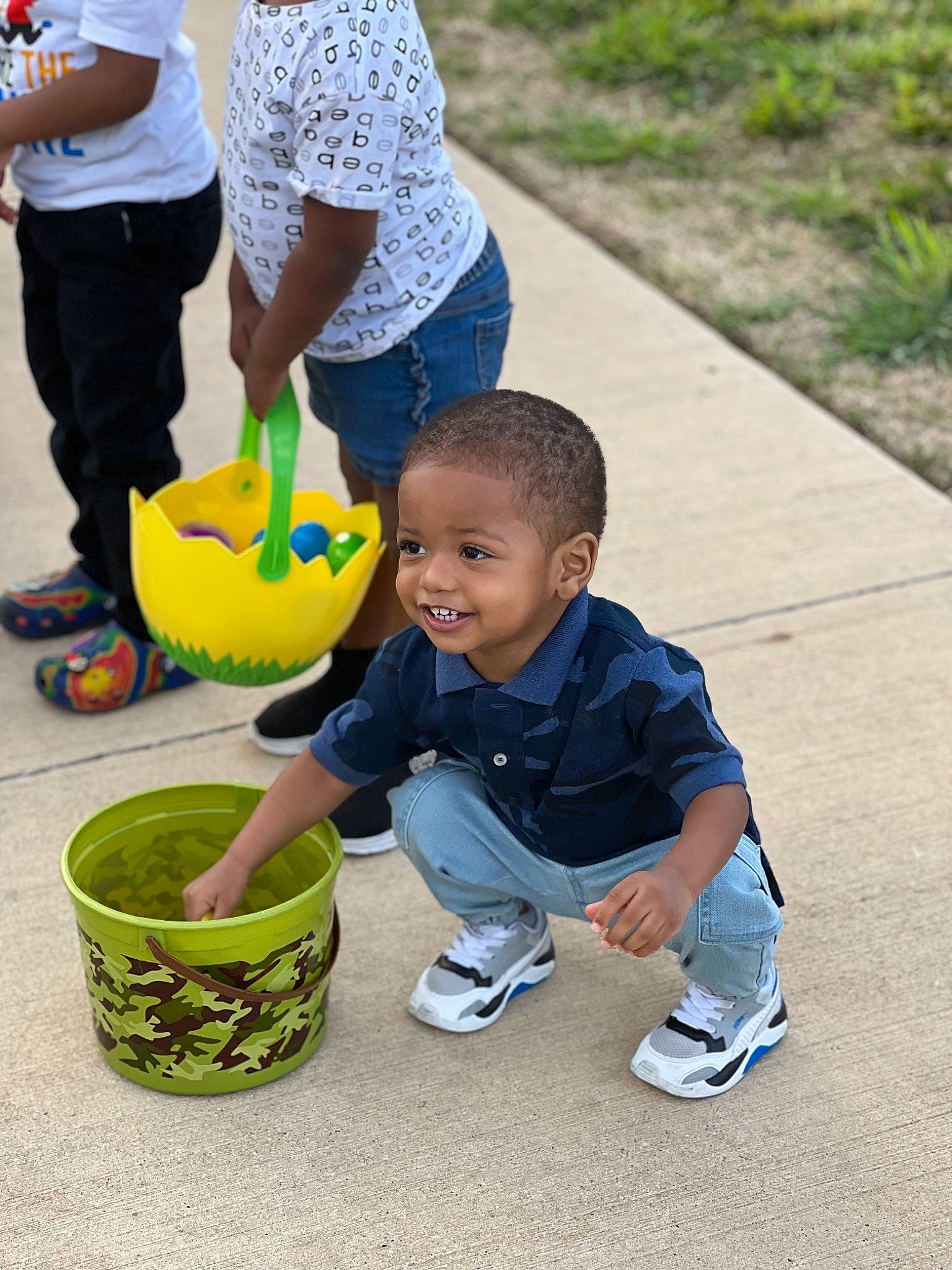 Ermias joined the competition — help win amazing prizes! child, fun, grass, green, happy, hat, leisure, people_in_nature, person, plant, play, recreation, shoe, shorts, sitting, smile, sneakers, t_shirt, toddler, water