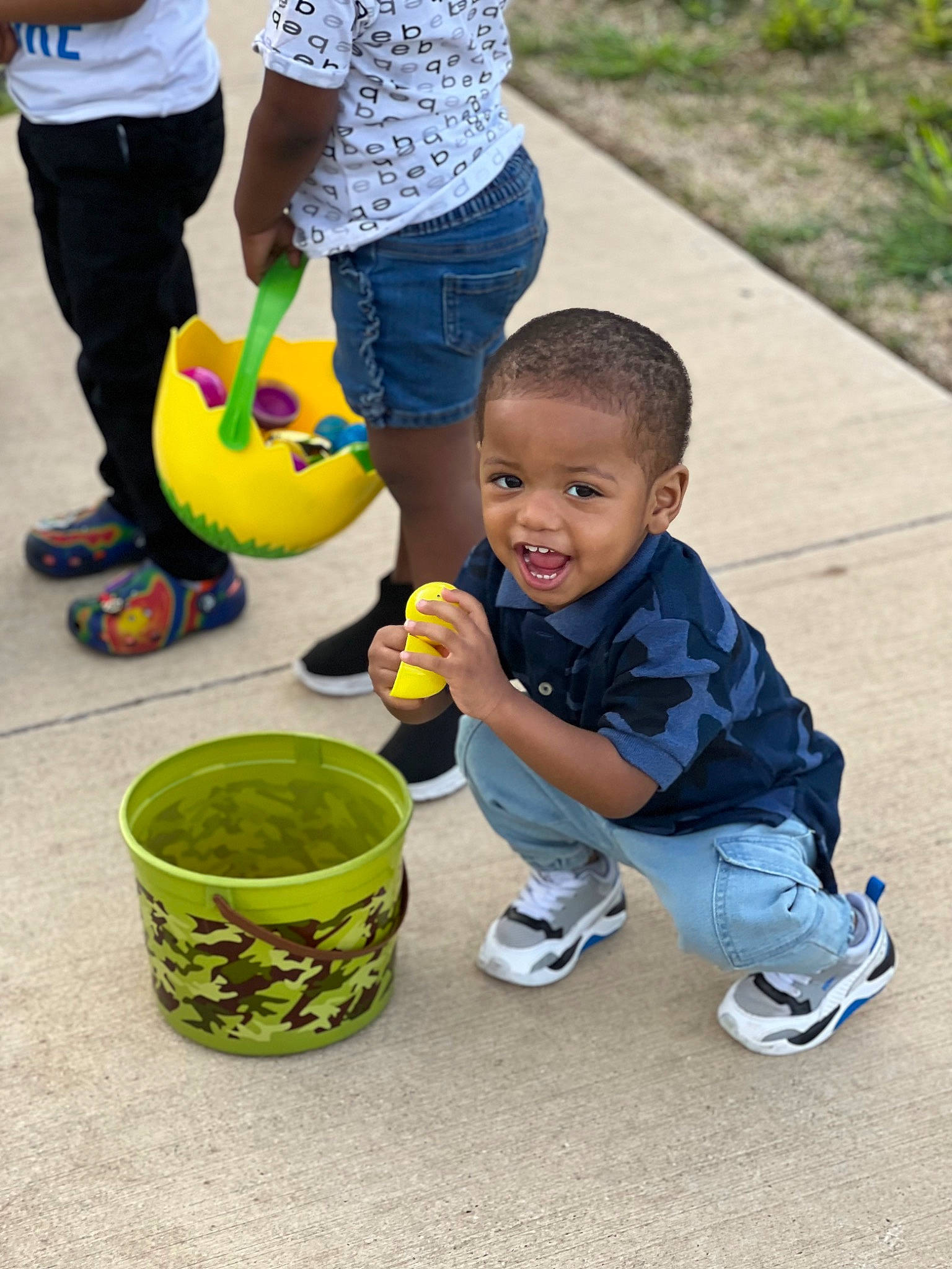 Ermias joined the competition — help win amazing prizes! baby, child, fun, grass, green, happy, leisure, person, plant, play, recreation, shoe, shorts, sitting, smile, sneakers, t_shirt, toddler, toy, water