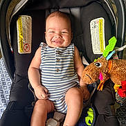 Kingston joined the competition — help win amazing prizes! baby, car_seat, smile, child, toy, stuffed_animal, romper, indoor, warning_label, patterned_fabric, happy, infant, seat_belt, plush_toy, person, cute, chubby_cheeks, colorful, comfort, playful