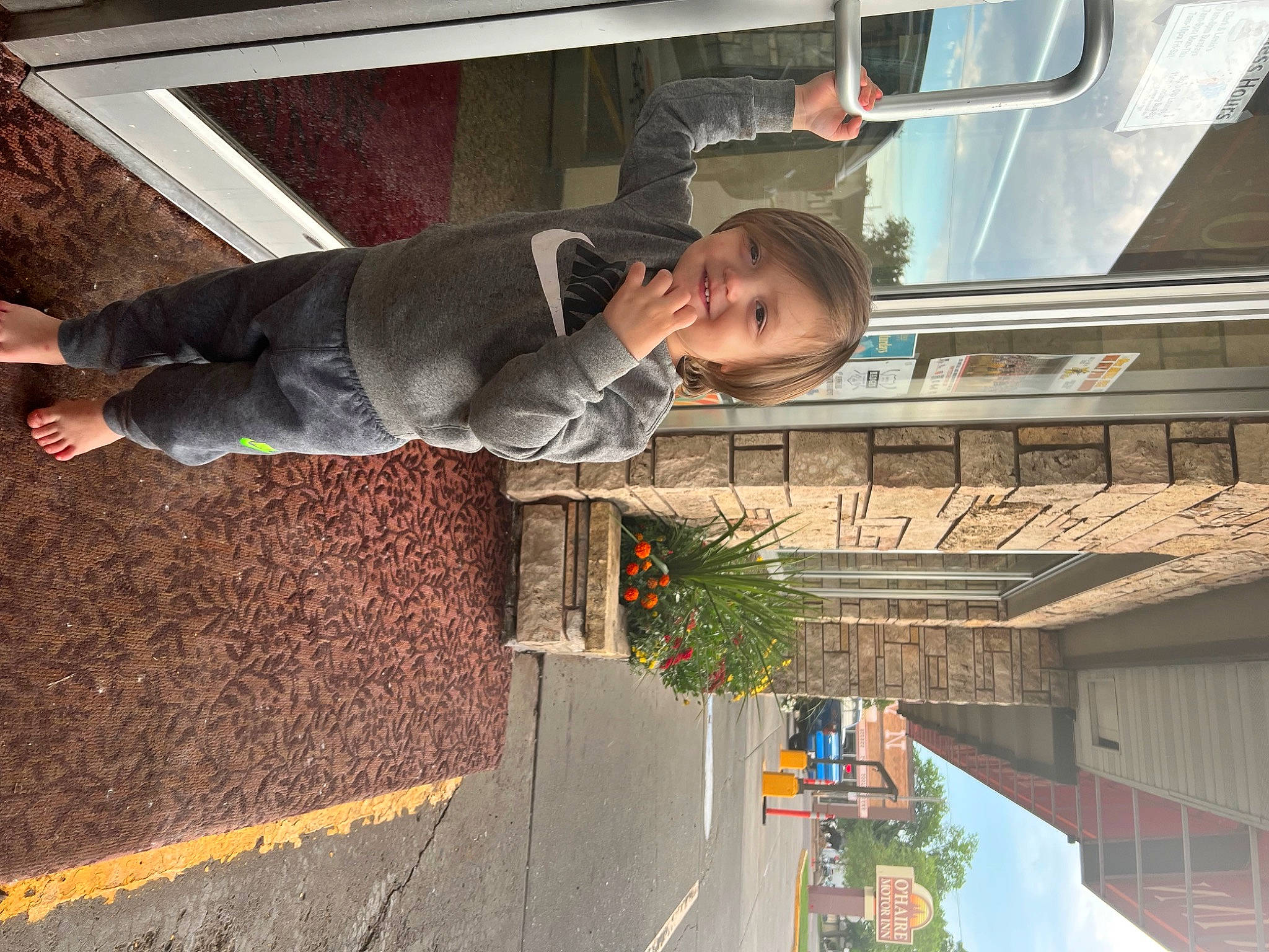 Owyn joined the competition — help win amazing prizes! asphalt, child, facade, fun, hat, jacket, joy, leisure, person, plant, road_surface, shadow, sidewalk, smile, street, toddler, transport, travel, tree, wood