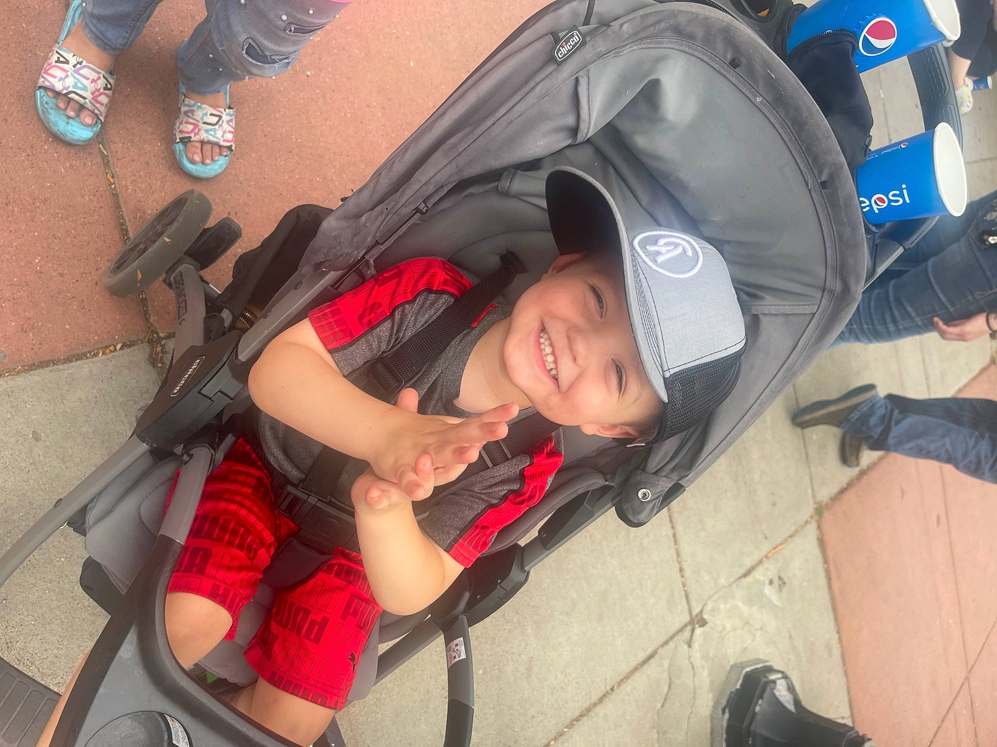 Owyn is registered to the contest to win money with this photo: auto_part, automotive_design, automotive_exterior, automotive_lighting, automotive_tire, automotive_wheel_system, bag, electric_blue, headwear, human_leg, joy, motor_vehicle, person, personal_protective_equipment, photograph, recreation, shoe, shorts, smile, sneakers