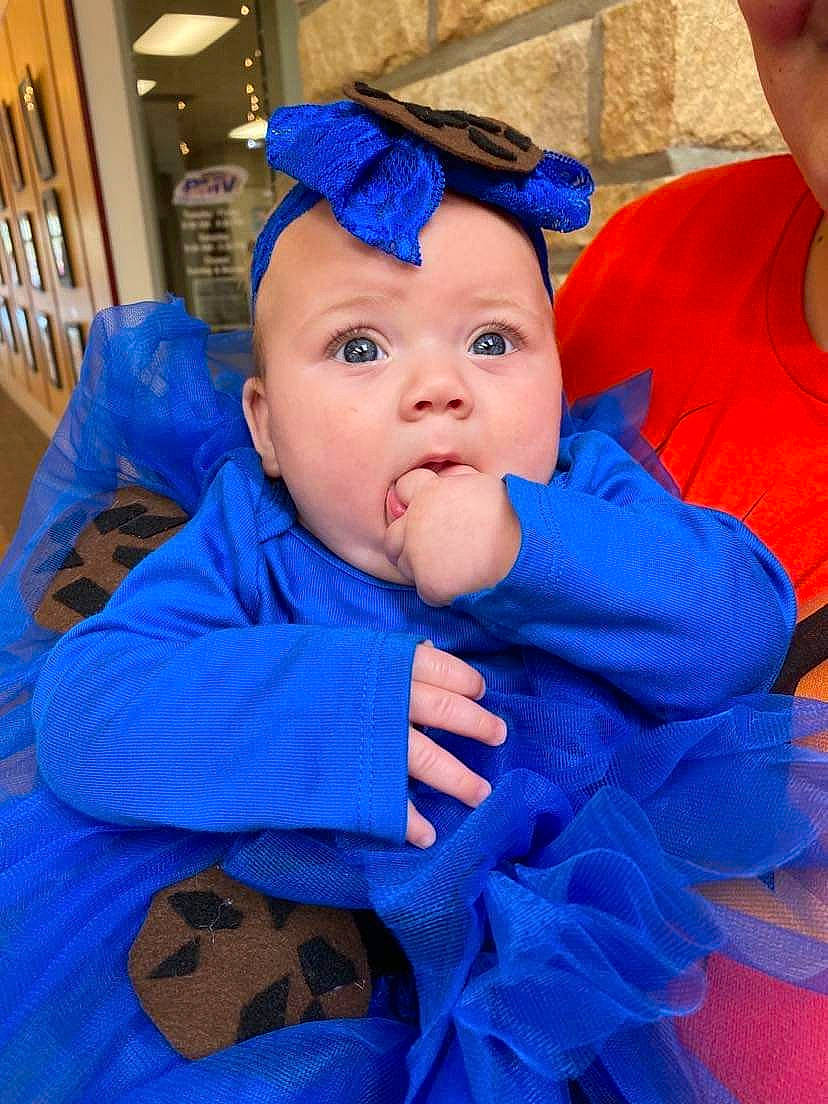 Gracelyn Lutz is registered to the contest to win money with this photo: baby, baby_products, baby_toddler_clothing, beanie, blue, cap, cheek, child, costume, costume_hat, electric_blue, event, fashion_accessory, fun, happy, headwear, iris, person, personal_protective_equipment, purple