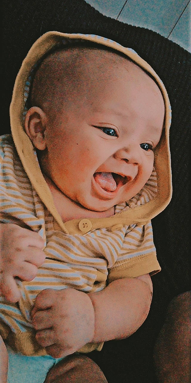 Rycki is registered to the contest to win money with this photo: baby, baby_toddler_clothing, cheek, chin, comfort, finger, gesture, happy, headgear, iris, lip, mammal, mouth, nose, people, person, pink, product, skin, sleeve