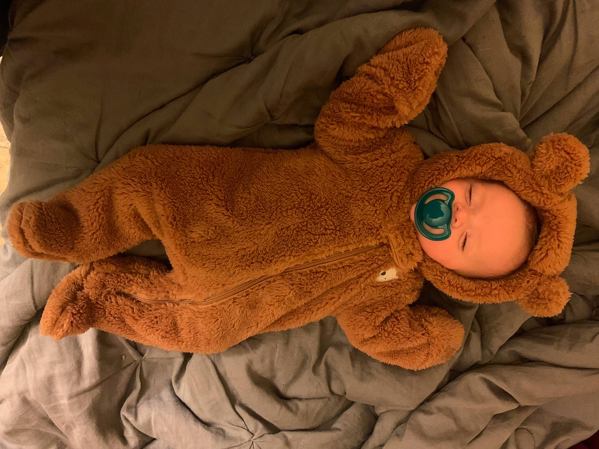 Paxton is registered to the contest to win money with this photo: art, baby, baby_products, baby_sleeping, baby_toddler_clothing, comfort, craft, doll, hat, linens, pattern, person, plush, sleeve, stuffed_toy, textile, thread, toy, wood, wool