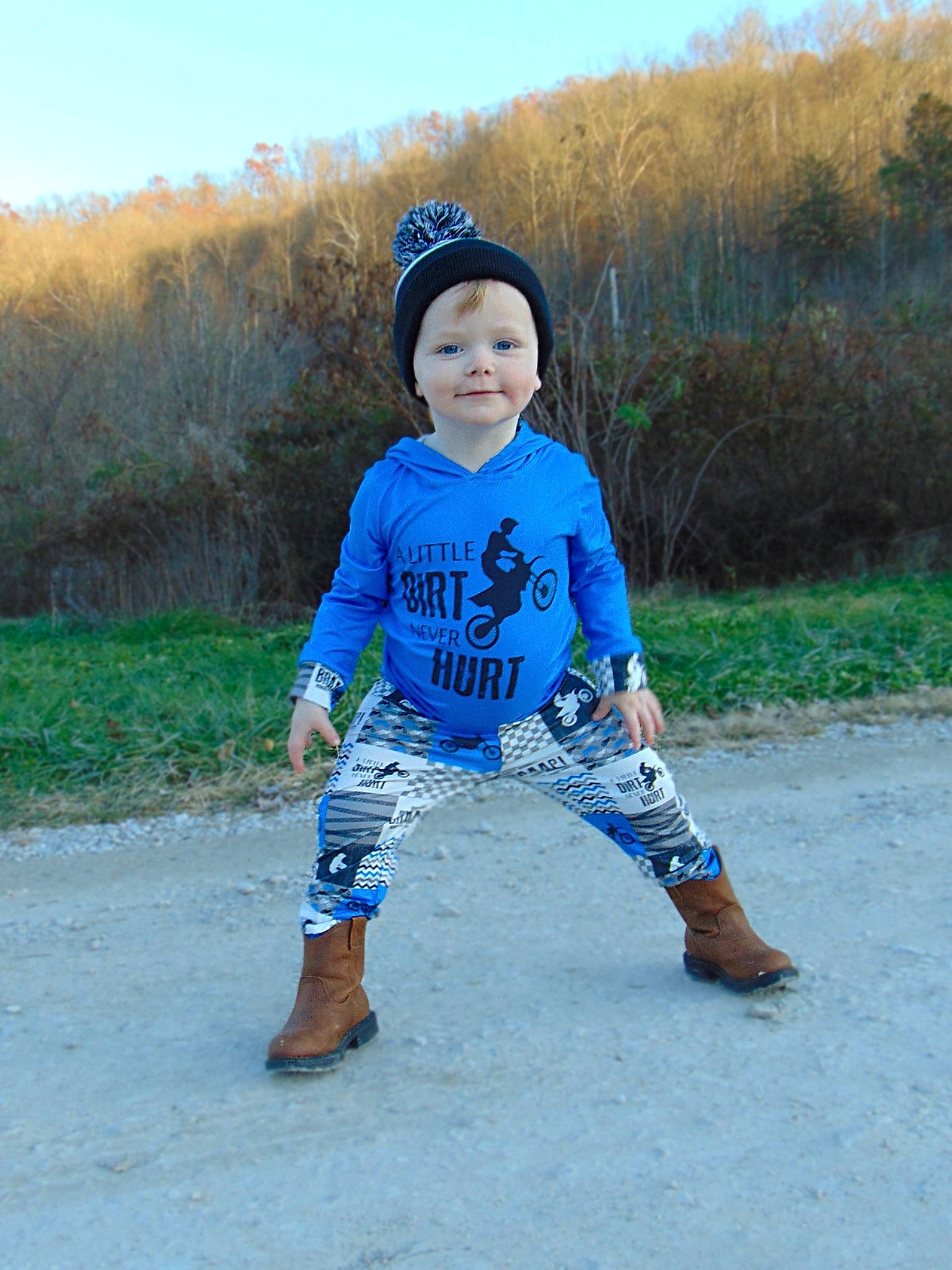 Weston is registered to the contest to win money with this photo: baby_toddler_clothing, cap, child, electric_blue, eye, fun, happy, joy, landscape, leg, leisure, person, personal_protective_equipment, plant, recreation, sand, sky, sleeve, soil, t_shirt