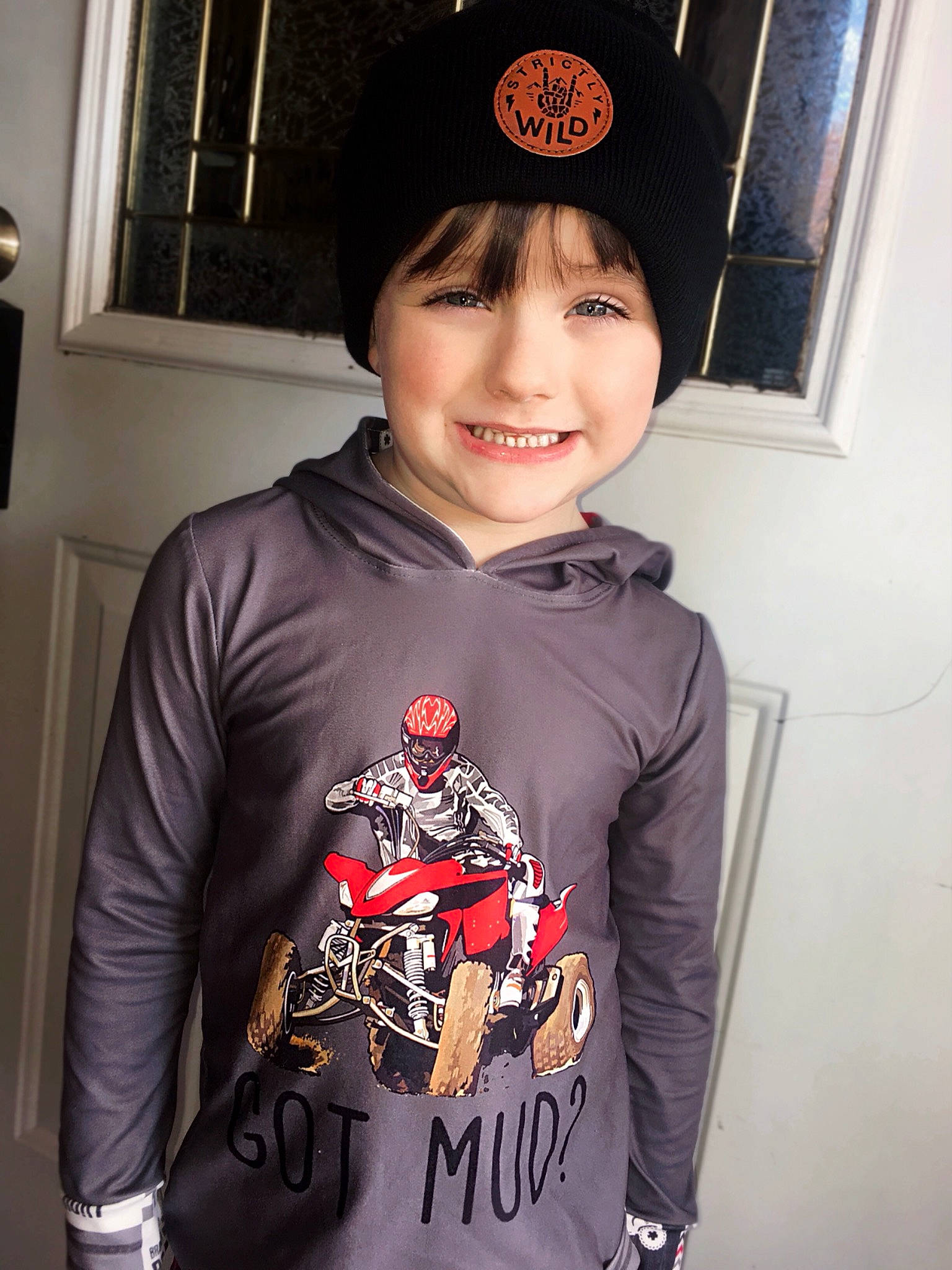 Dawson is registered to the contest to win money with this photo: active_shirt, black, cap, carmine, cool, fashion_accessory, font, happy, headgear, headwear, hood, joy, lamp, neck, outerwear, person, picture_frame, sleeve, smile, sportswear