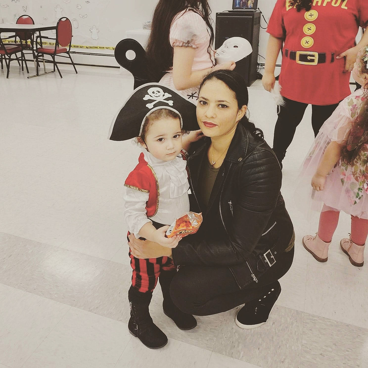 Lancer is registered to the contest to win money with this photo: art, boot, carmine, child, costume, event, fashion_design, flooring, friendship, fun, fur, hairstyle, happy, interaction, joy, leg, overcoat, person, recreation, shoe