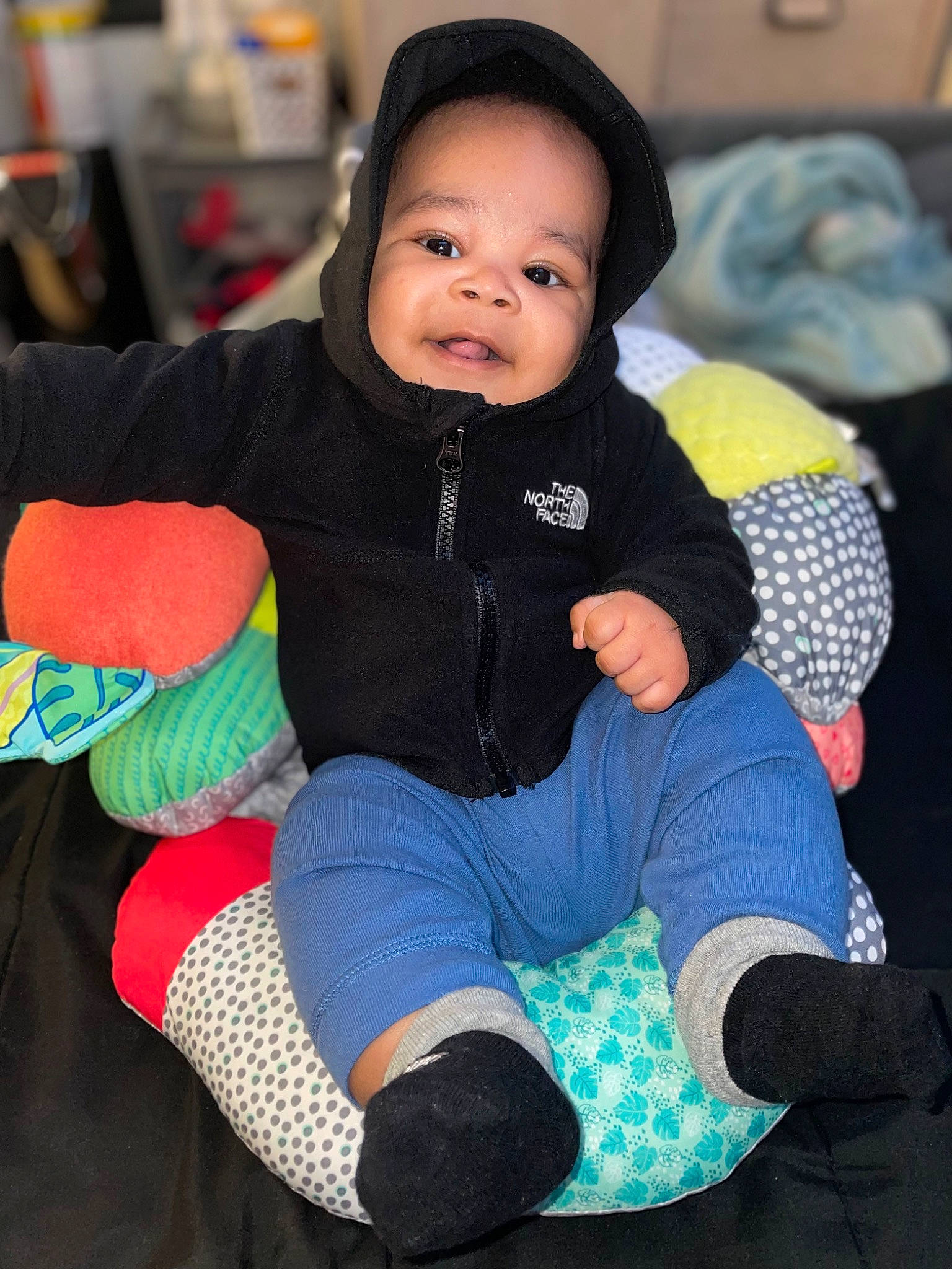 Mathias is registered to the contest to win money with this photo: baby, baby_toddler_clothing, child, comfort, cool, electric_blue, finger, foot, fun, happy, headgear, human_leg, knee, lap, person, personal_protective_equipment, sitting, sleeve, sock, thigh