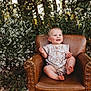baby, child, smiling, armchair, leather, flower, nature, outdoor, greenery, plant, portrait, happy, cute, infant, sitting, sunlight, face, skin, clothing, grass