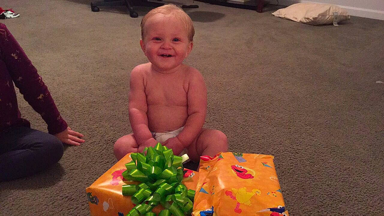 Johnathan is registered to the contest to win money with this photo: child, fun, infant, person, play, sitting, smile, toddler