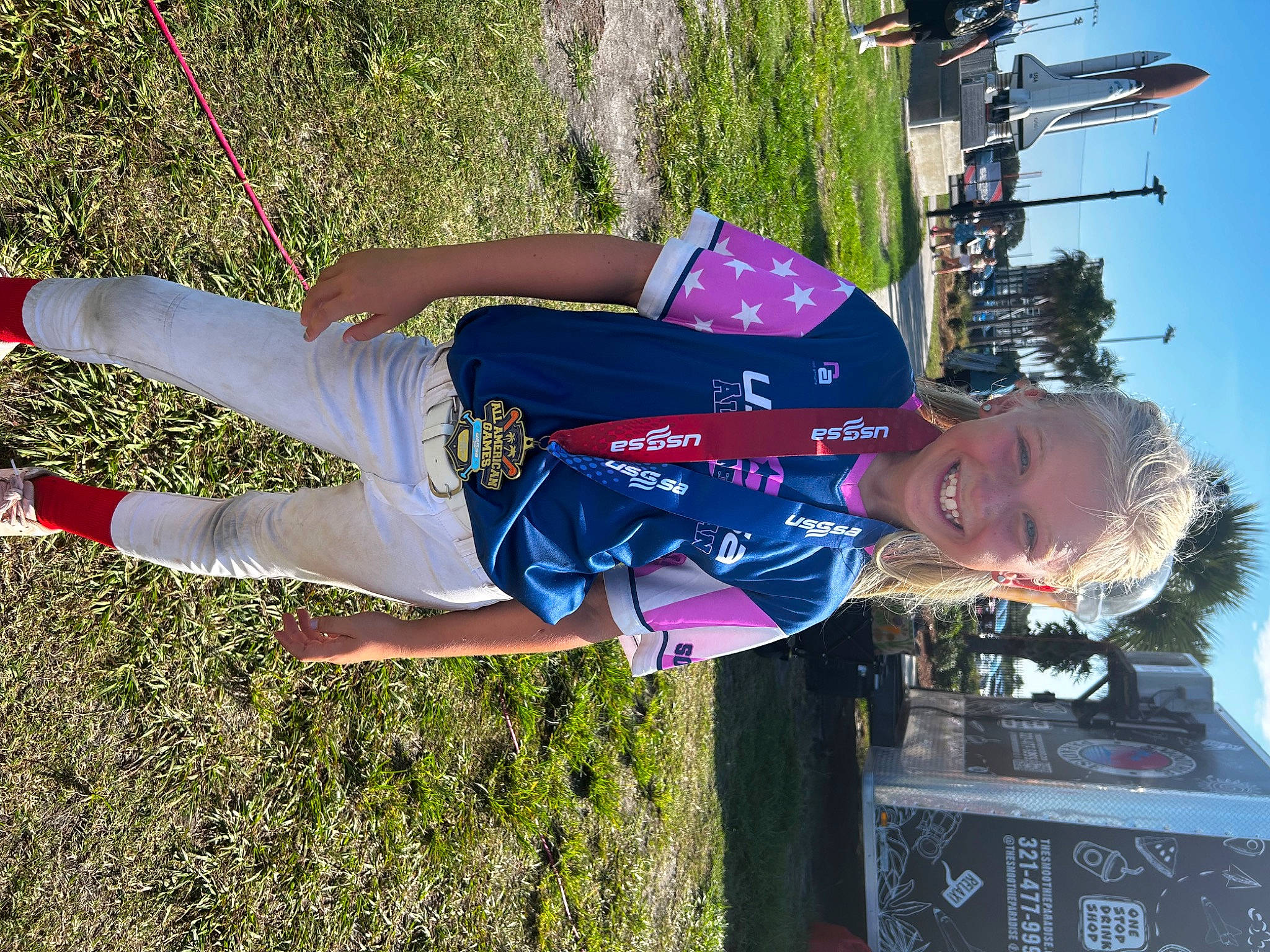 Phoenix is registered to the contest to win money with this photo: arm, electric_blue, fun, grass, happy, hat, human_leg, joy, leisure, person, plant, recreation, sky, smile, t_shirt, thigh, travel, tree