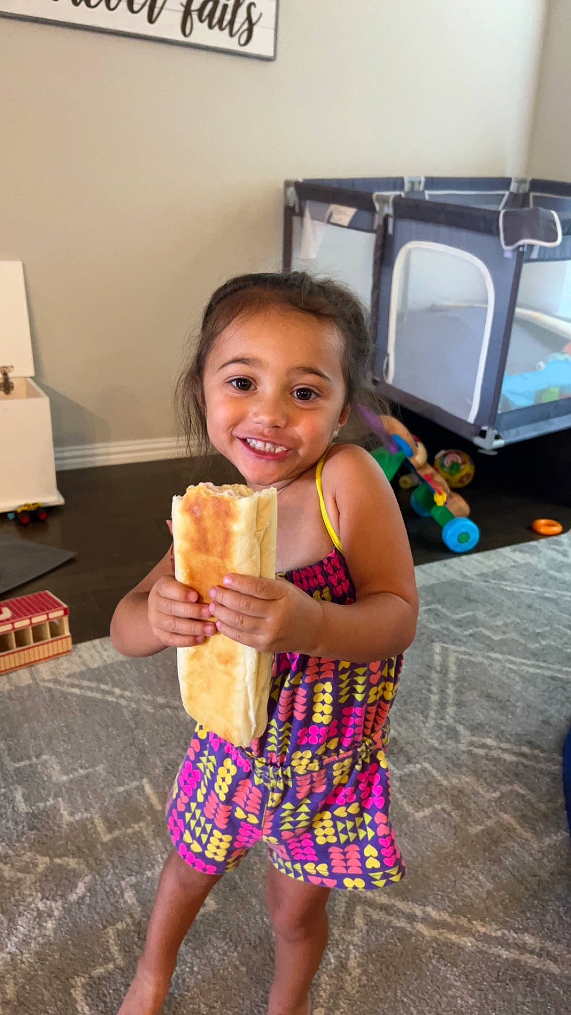 Stella is registered to the contest to win money with this photo: child, dessert, dish, dress, event, eye, face, flooring, food, food_craving, fun, happy, joy, party, person, smile, snapshot, standing, sweetness, tableware