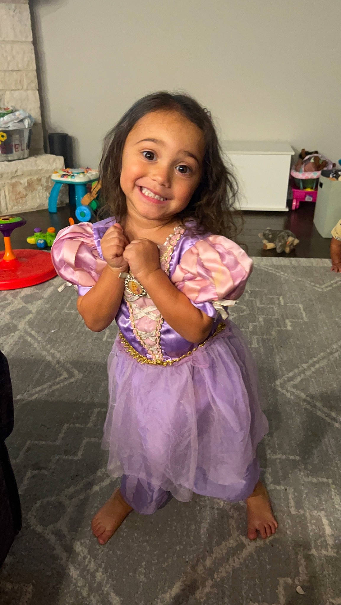 Stella joined the competition — help win amazing prizes! child, dress, event, fashion_design, floor, flooring, fun, happy, head, iris, joy, magenta, party, person, pink, purple, room, sandal, sitting, skin