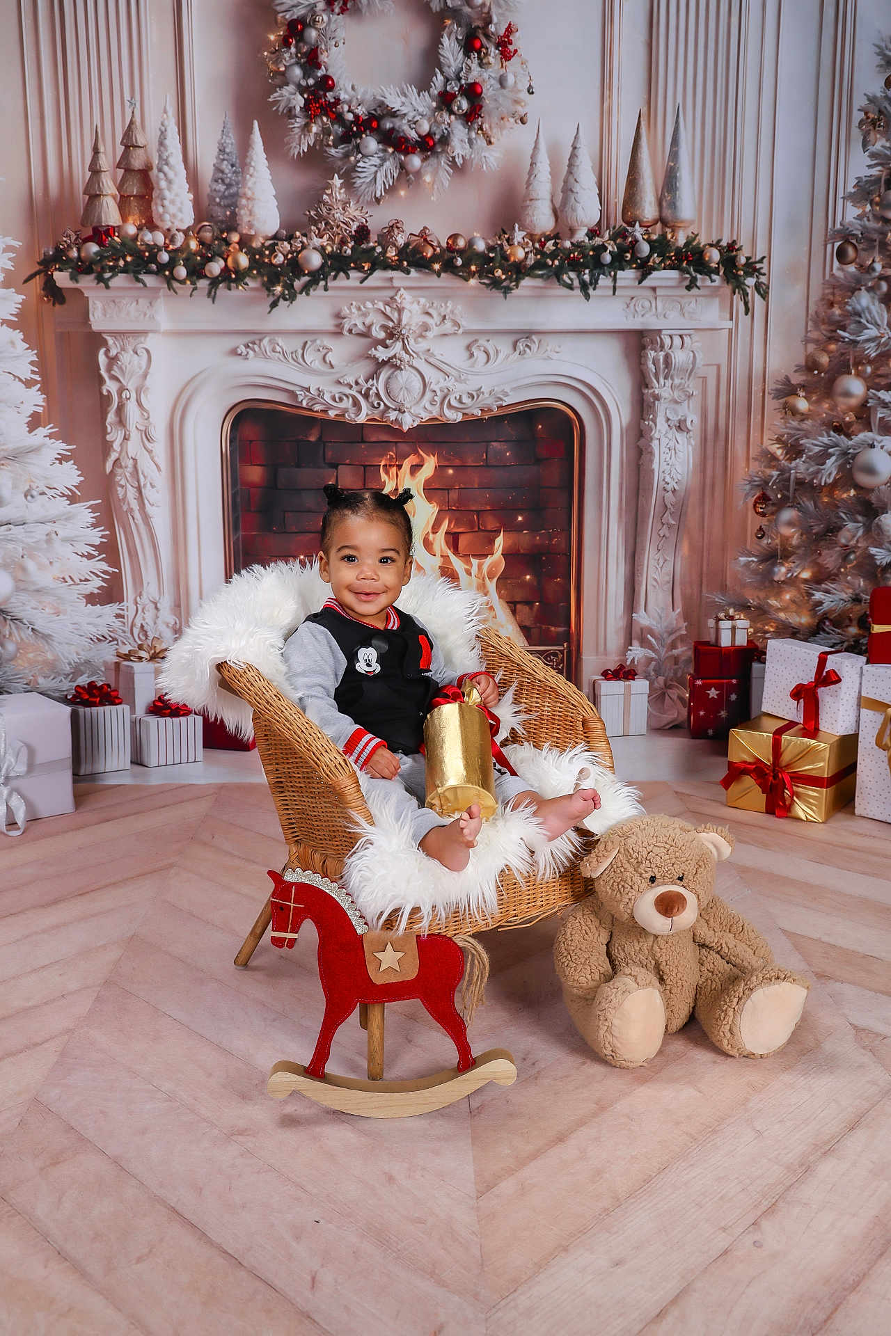 Ayden participe au concours pour gagner de l'argent avec cette photo : toddler, child, smiling, chair, gift, fireplace, christmas_decorations, wreath, christmas_tree, present, toy, teddy_bear, rocking_horse, holiday, indoor, flooring, cozy, festive, winter, celebration