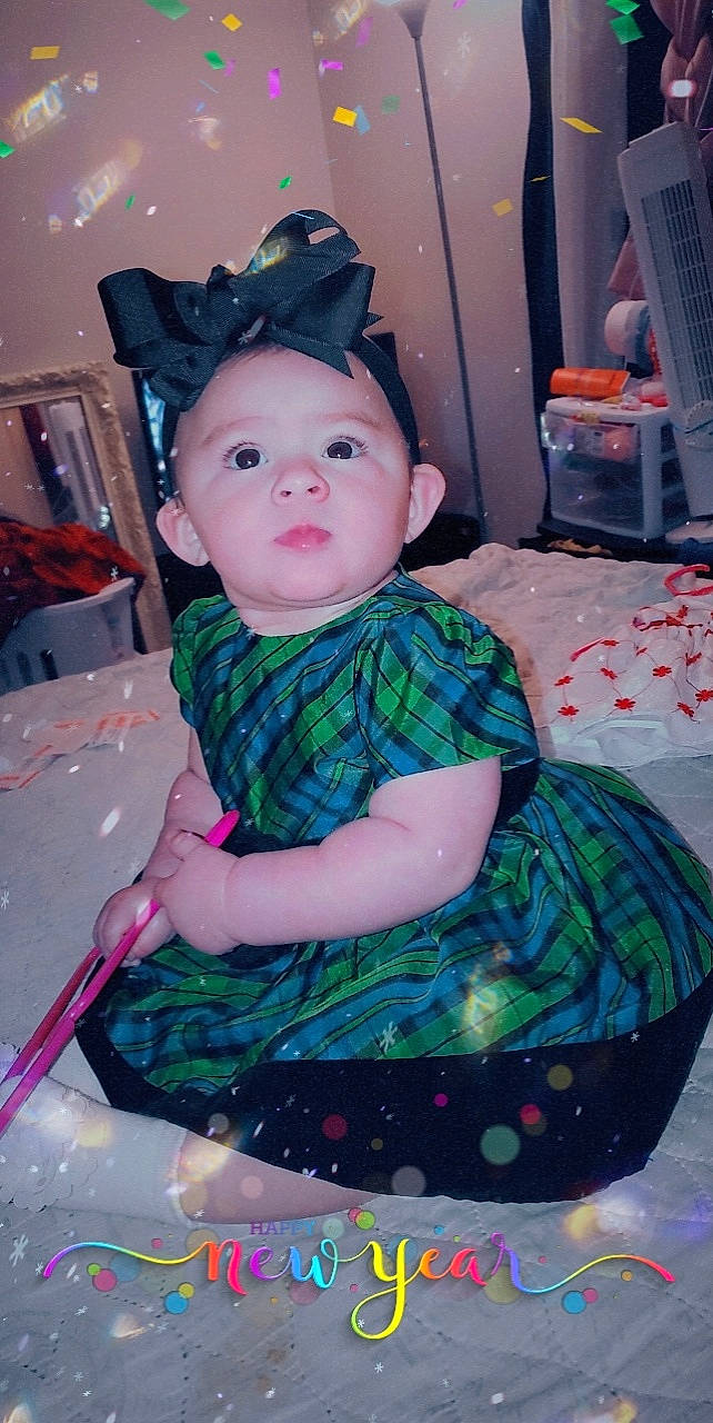 Marissa is registered to the contest to win money with this photo: baby, baby_toddler_clothing, cheek, costume, dress, event, eye, face, fashion_accessory, fun, hat, holiday, human_body, iris, magenta, pattern, person, pink, purple, sun_hat