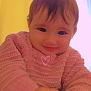 Lëynah participe au concours pour gagner de l'argent avec cette photo : baby, child, smiling, pink_sweater, indoor, portrait, cute, face, hands, cozy, warm_light, curtains, heart_doodle, happy, infant, person, closeup, soft_light, young_child, casual_clothing