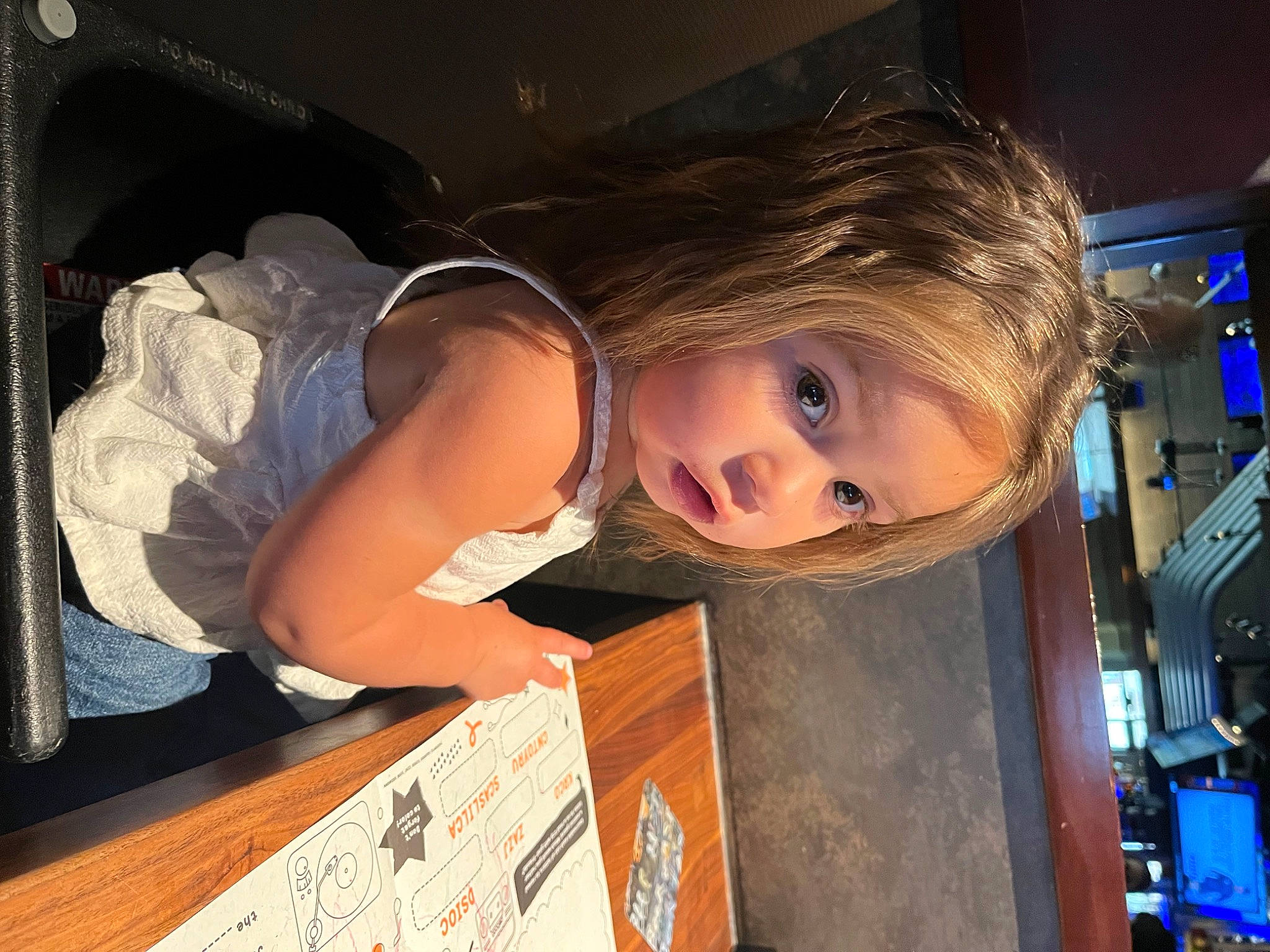 Luna is registered to the contest to win money with this photo: blond, elbow, eye, eyelash, flash_photography, fun, human_leg, luxury_vehicle, machine, person, room, smile, toddler, vacation, vehicle_door, wood