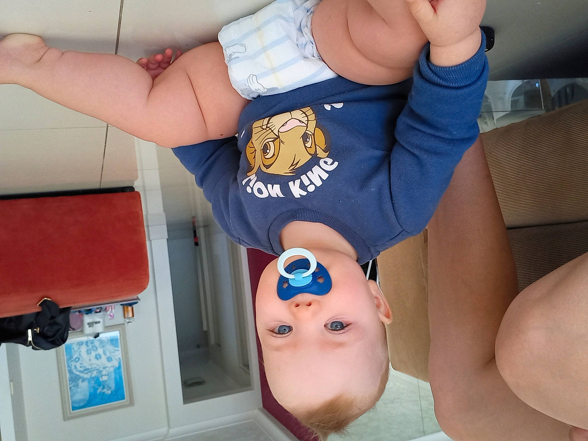 Noah is registered to the contest to win money with this photo: arm, child, elbow, electric_blue, eyelash, finger, gesture, hat, human_leg, joint, knee, mouth, nail, person, sleeve, thigh, thumb, trunk, waist, white