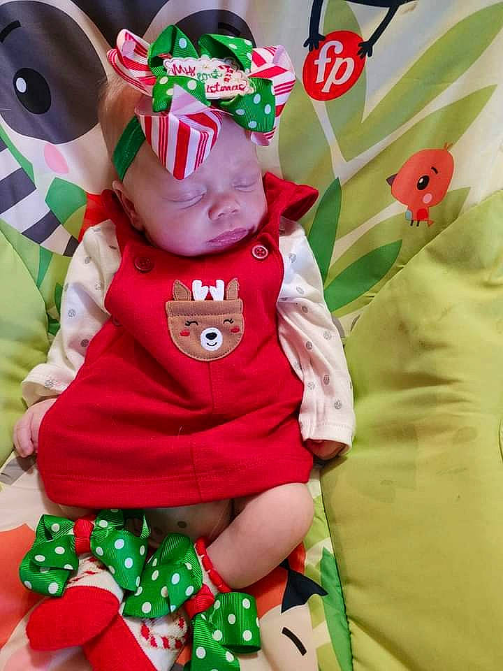 Jasmine joined the competition — help win amazing prizes! baby_toddler_clothing, carmine, child, costume_hat, event, fictional_character, grass, green, happy, hat, headgear, headwear, holiday, person, plant, plush, red, sleeve, stuffed_toy, t_shirt