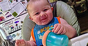 Blaze joined the competition — help win amazing prizes! baby, bib, child, cute, drinkware, expression, face, food, furniture, high_chair, home, indoor, infant, kitchen, magnet, person, sippy_cup, smiling, sticker, table