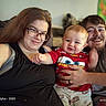 Blaze joined the competition — help win amazing prizes! adult, baby, casual_clothing, child, colorful_background, couch, family, glasses, happy, home, indoor, light, man, people, photography, portrait, red_shirt, seated, smile, woman