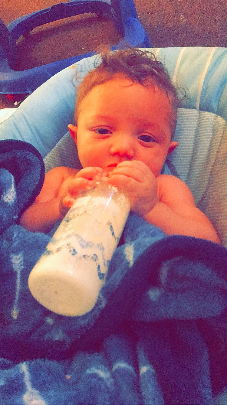 Ellis is registered to the contest to win money with this photo: baby, baby_bottle, baby_products, bottle, cheek, child, drinkware, face, mouth, nose, person, product, skin, tableware, toddler