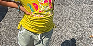 Janyla joined the competition — help win amazing prizes! child, smiling, yellow_shirt, crochet_hat, beads, shorts, sneakers, parking_lot, sunny, shadow, sidewalk, bracelet, outdoor, person, casual, happy, standing, colorful, summer, fashion