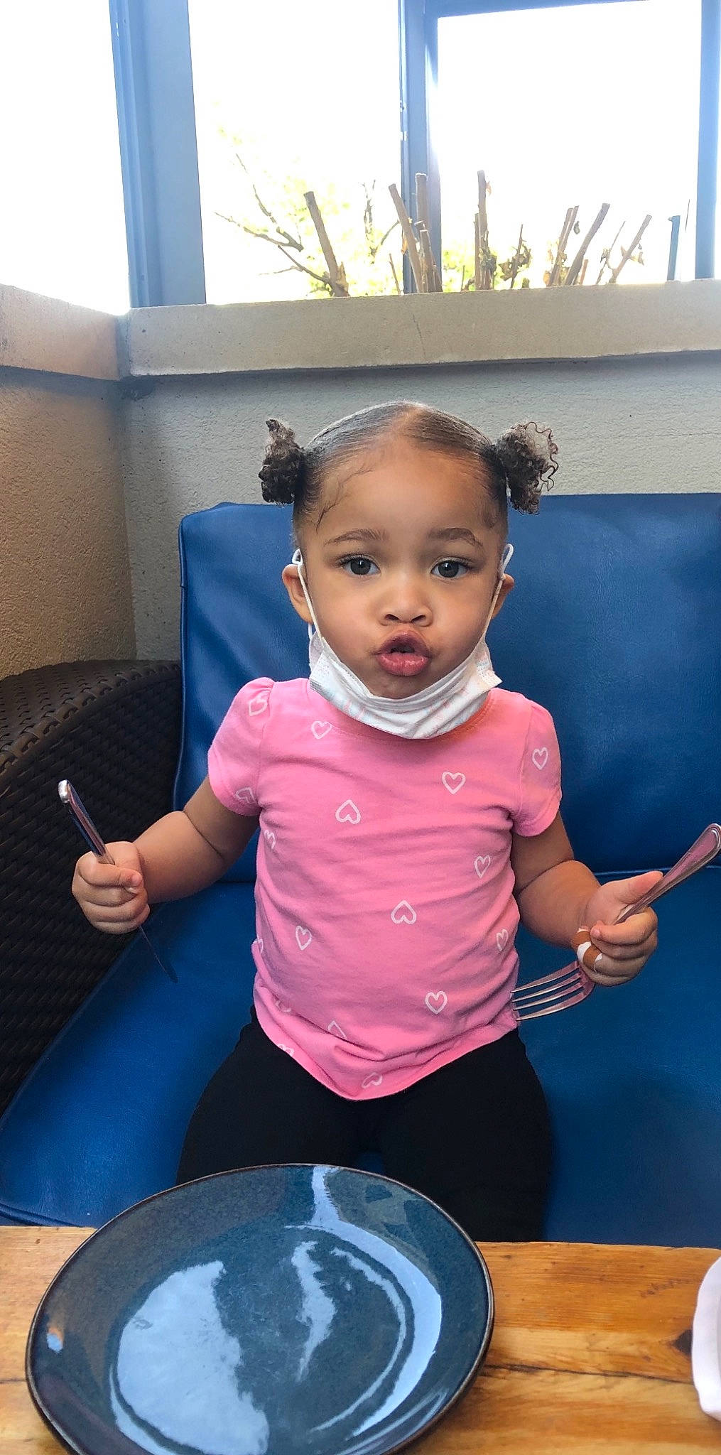 Alaiya is registered to the contest to win money with this photo: baby_toddler_clothing, chair, child, comfort_food, cooking, cookware_and_bakeware, dishware, food, fun, hair, happy, magenta, person, plate, room, sitting, standing, t_shirt, table, toddler