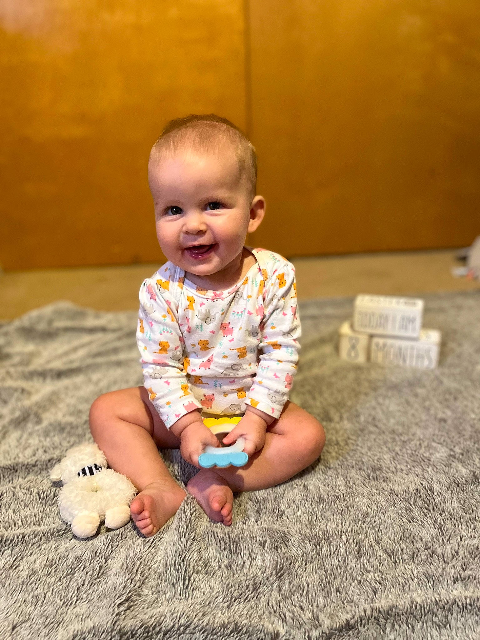 Blakelyn joined the competition — help win amazing prizes! baby, baby_toddler_clothing, cheek, child, comfort, eye, floor, flooring, foot, fun, grass, happy, hardwood, head, joy, person, sitting, skin, sleeve, smile